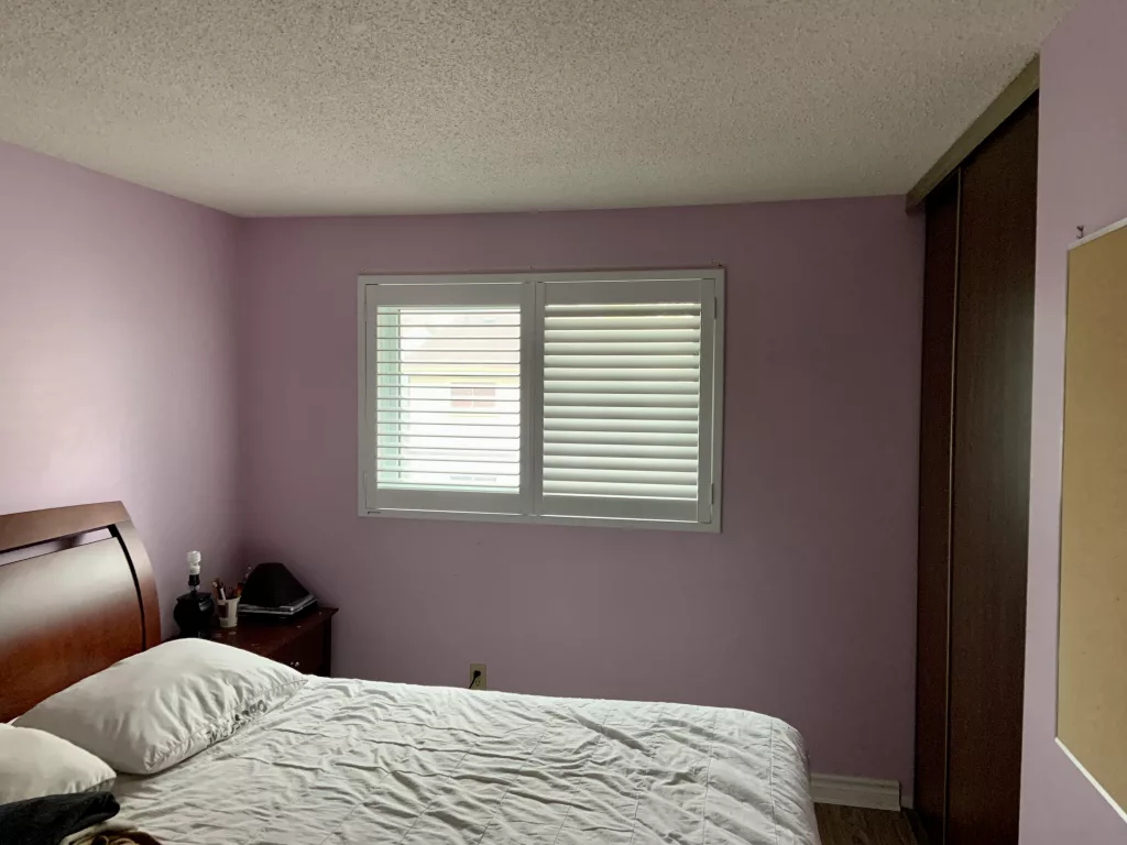 Bedroom with PVC California Shutters from ShutterLux