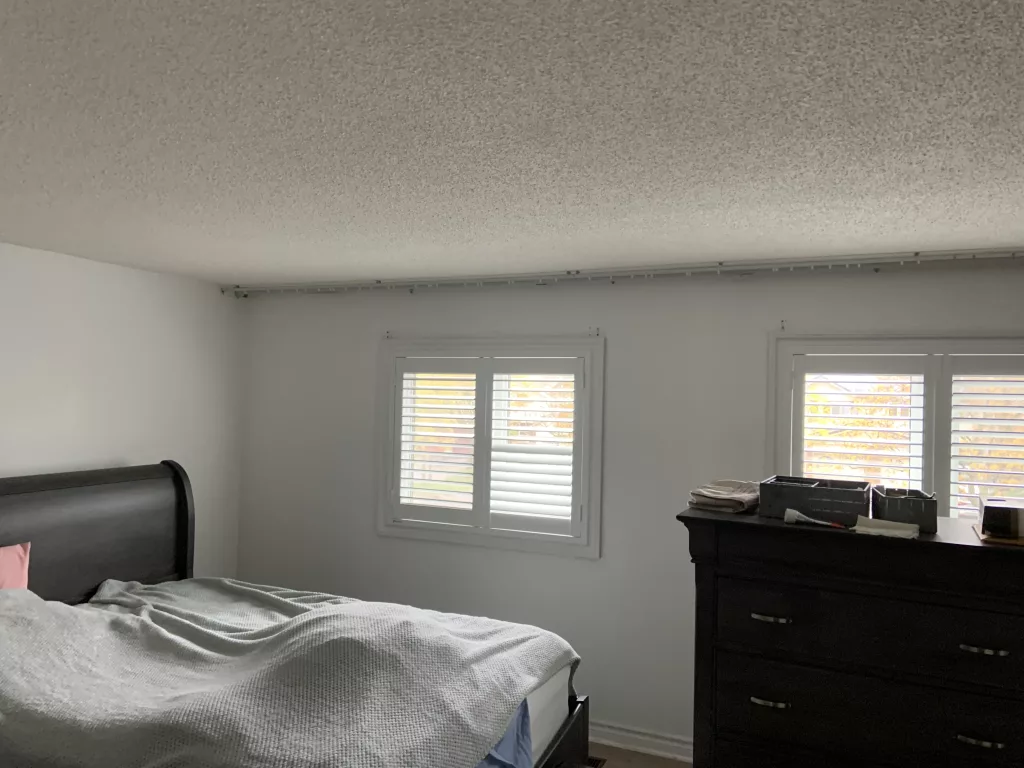 Bedroom with PVC California Shutters from ShutterLux