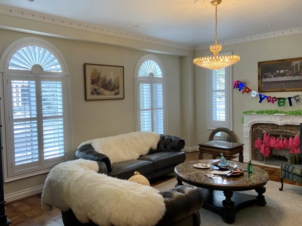 Living room with arches California shutters