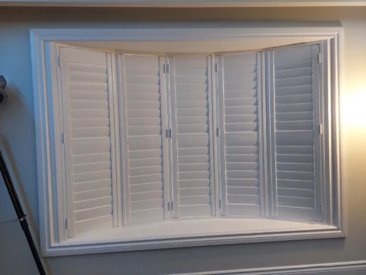 Beautiful bay windows with ShutterLux California Shutters, closed