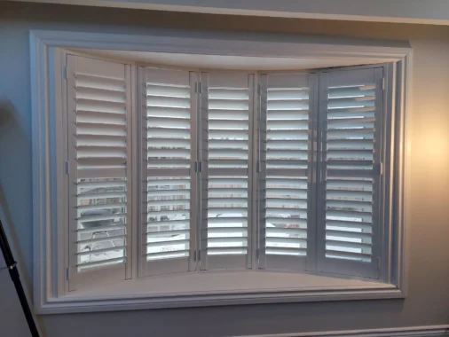 Beautiful bay windows with ShutterLux California Shutters