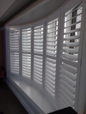 Beautiful bay windows with ShutterLux California Shutters, side view