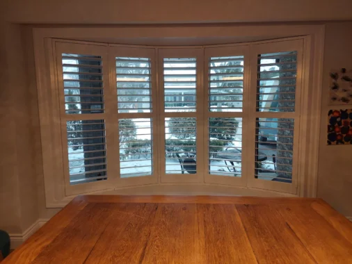 Beautiful bay windows with ShutterLux California Shutters