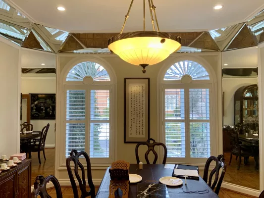Dining room with arches California shutters